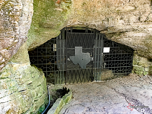 The CCC era 'Texas' motif gate. Entrance to Longhorn Cavern.