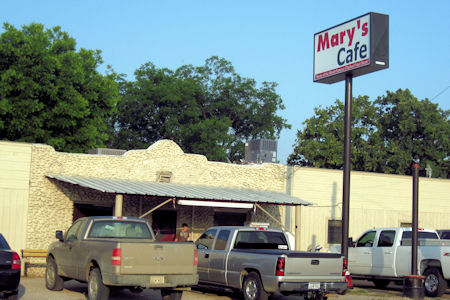 Pick ups crowded around Mary's Cafe