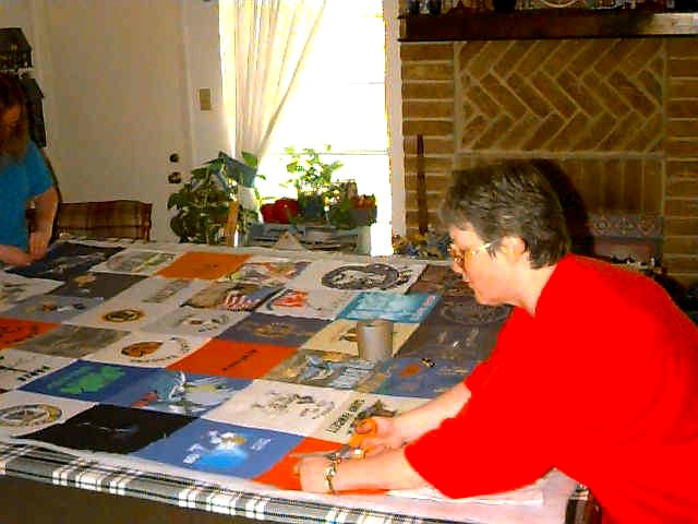 Bonnie, Clara tying a quilt