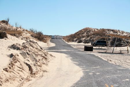 Be sure and keep your vehicle on the pavement. If you drive in the sand you will get stuck.